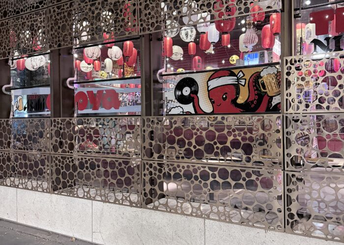 Custom reverse-printed window graphics and decorative privacy film installed on a commercial shopfront, combining branding, privacy and visual impact for a retail environment.