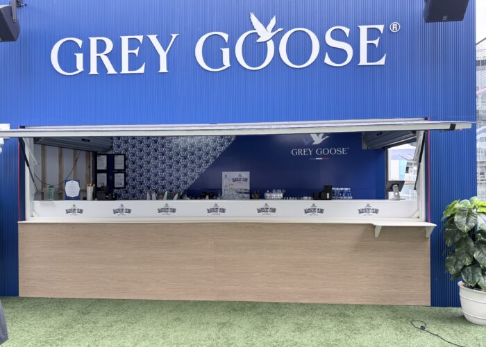 Custom hospitality venue branding featuring large-format 3D lettering and branded wall graphics installed on a Grey Goose beverage service bar.