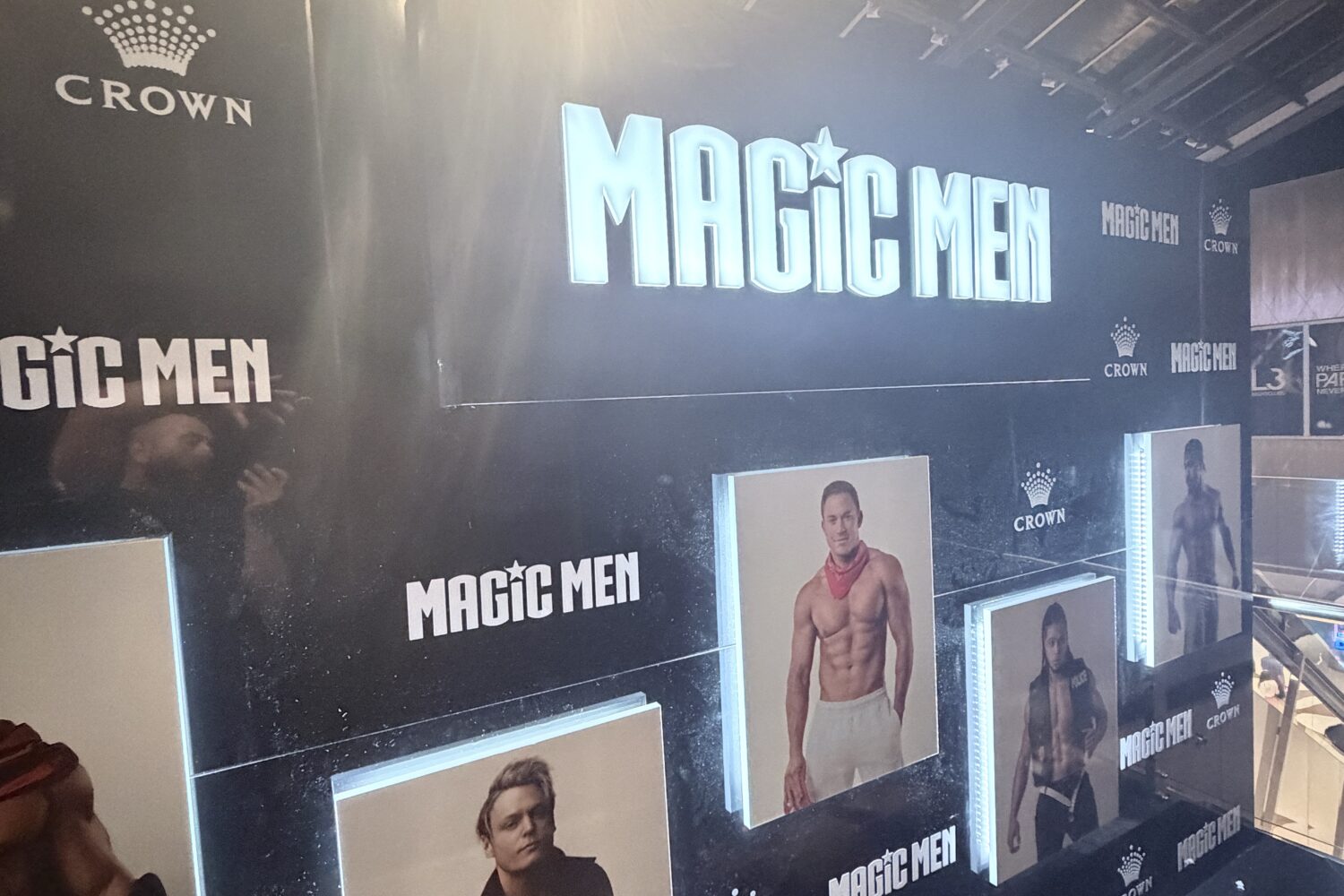 Illuminated promotional display wall for Magic Men at Crown Melbourne featuring custom LED lightboxes, event branding and large-format entertainment graphics.