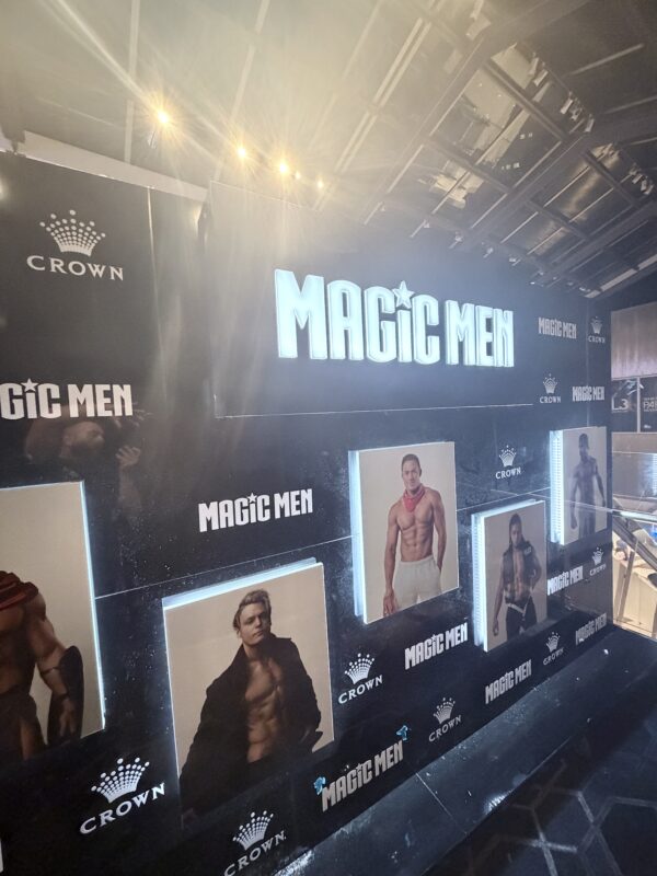 Illuminated promotional display wall for Magic Men at Crown Melbourne featuring custom LED lightboxes, event branding and large-format entertainment graphics.